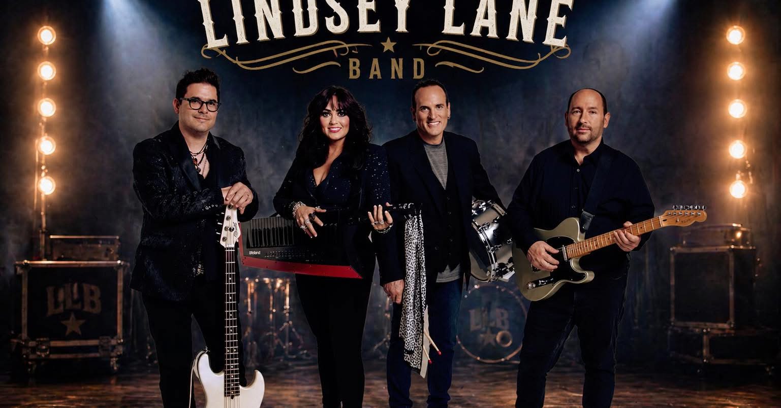 Four musicians stand together on a stage with their instruments—a bassist, keyboardist, guitarist, and drummer—under a glowing sign that reads 'Lindsey Lane Band'.